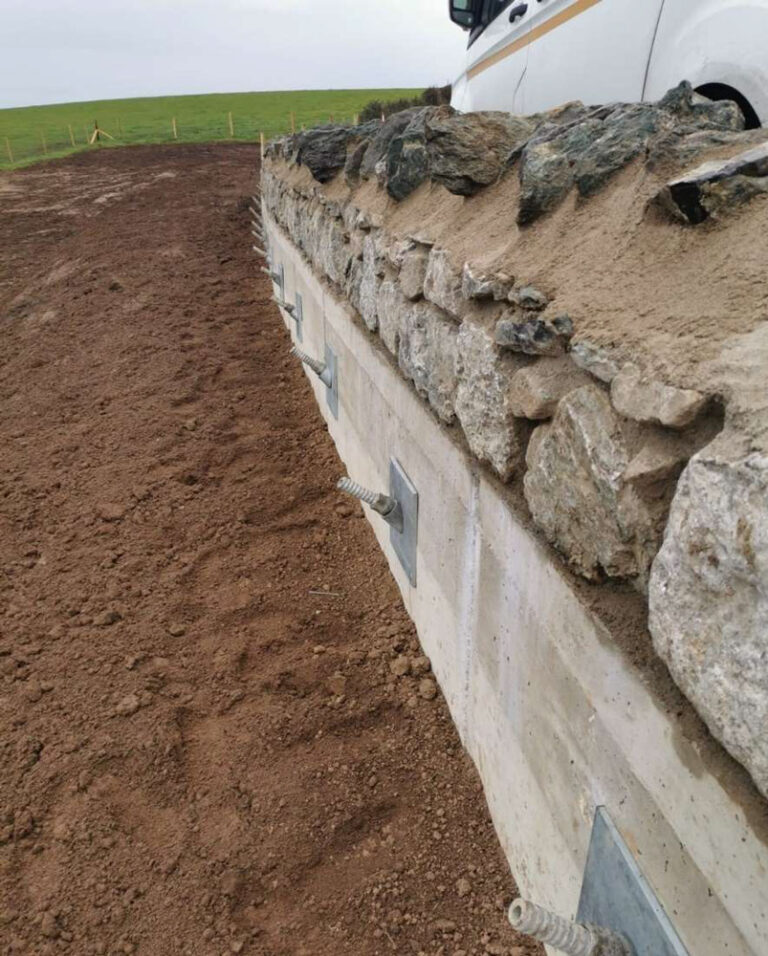 Completed nailed edge beam and parapet wall.